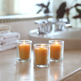 Bienenwachs-Votivkerze in goldener Tüte mit Etikett