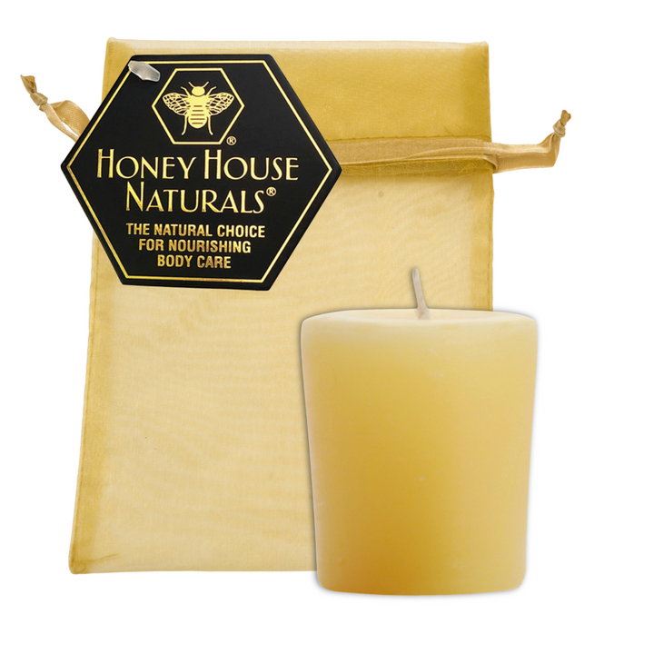 Bienenwachs-Votivkerze in goldener Tüte mit Etikett